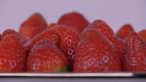 Close-up of Strawberries Rotating over white Background, Strawberries, Fruit Video stock 127998295