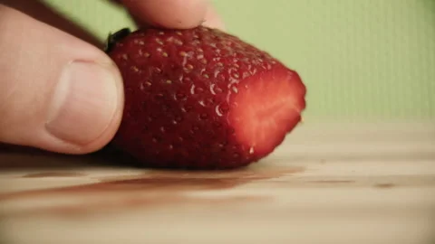 Close-up strawberry cutting with a knife Stock Footage 131819118