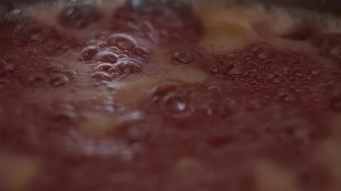 Close up of a Strawberry Jelly while Cooking (Slow-motion) Stockbeeldmateriaal 233471841