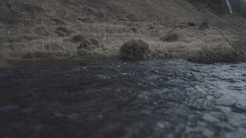 Close Up Stream Flowing Gentle in Front of Waterfall Stock Footage 183947950