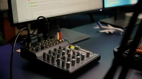 Close-up of streamer checking sound 写真素材