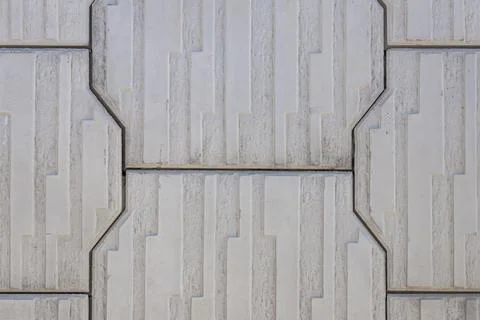 Close-up of a street gray polygonal tile with raised details. Tile pattern Stock Photos