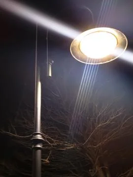 Close-up of an street lamp with split-beam shines into the camera, bottom vie Stock Photos