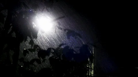 Close up of street light on rainy night with visible rain drop Stock Footage 108618508