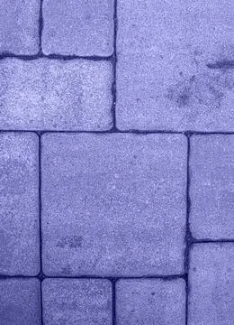Close up of street pavement pattern toned in very peri color Stock Photos