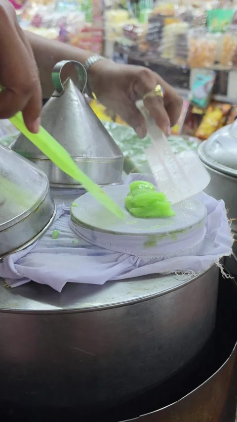 Close-up of street vendor making Thai steamed rice skin dumplings. Stock Footage 341955855