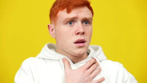 Close-up of stressed man having panic attack. Portrait of young redhead Stock Footage 148246508