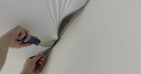 Close-up stretch ceiling, builder tucks edges of fabric ceiling behind fasteners Stock Footage 131035922