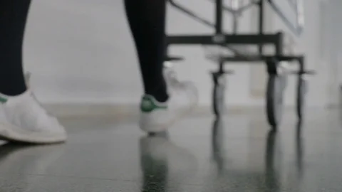 Close-up of the stretcher wheels passing through the hospital Stock Footage 121097582