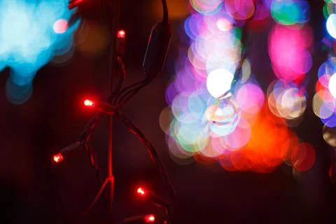 Close up of a string of Christmas Lights with Bokeh lights in the background Stock Photos