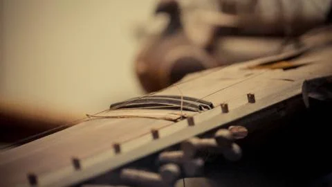 A close up of a string instrument Stock Photos