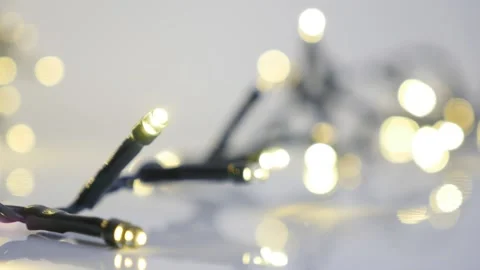 Close-up of string with sparkling fairy lights slow-mo Stock Footage 87790178