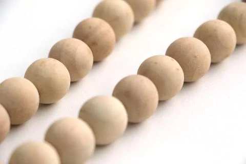 Close up of string of wooden beads Stock Photos