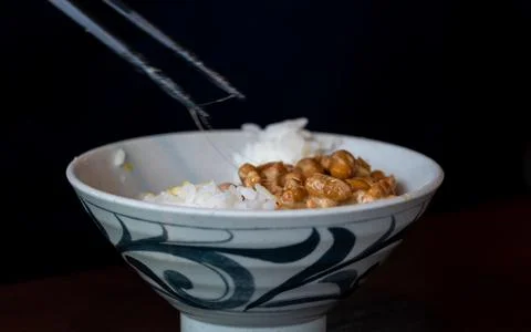 A close-up of the stringy texture of authentic Japanese natto rice picked u.. Stock Photos