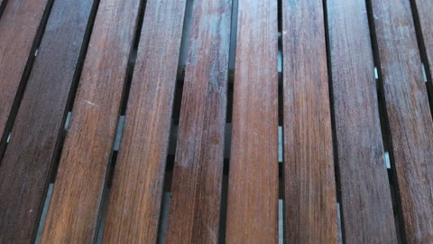 Close-up of a striped wooden table Stock Footage 245105859