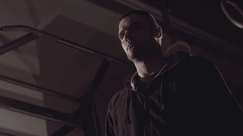 Close-up of strong concentrated man working out with sledgehammer in hands. Stock-Footage 76903487