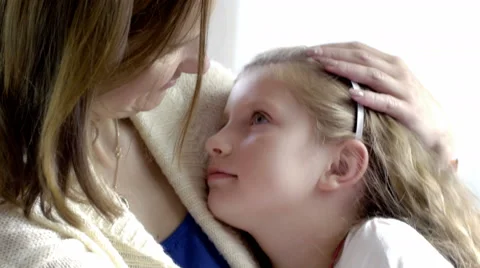Close-up of a strong contact between a little girl and loving mother Stock Footage 67119359