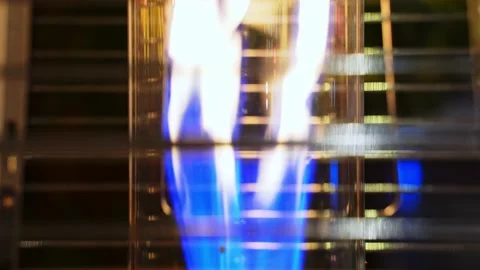 Close-up of a strong fire from a gas burner in a metal grate. Stock Footage 232269657