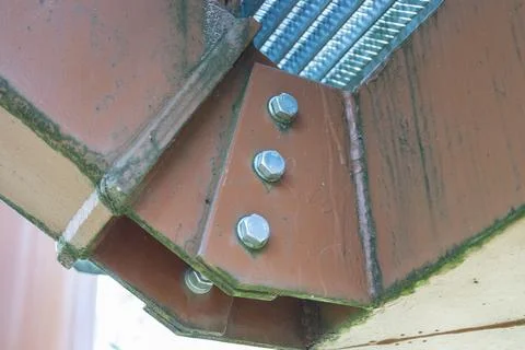 Close-up of structural steel connection joint with bolts and welds Stock Photos
