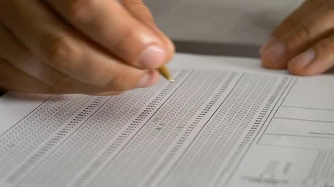 Close up on student hand filling multiple choice test Stock Footage 78070653