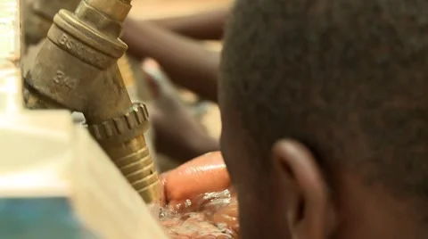 CLOSE UP: STUDENT HAND UNDER RUNNING WATER FROM FAUCET, Stock Footage 60116166
