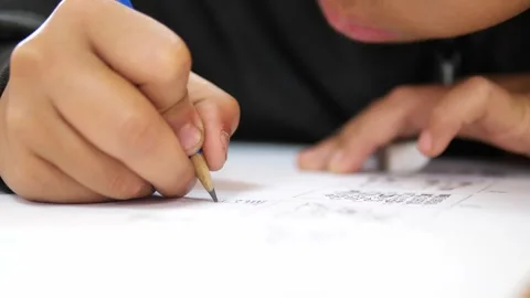 Close-up of student hand writing on paper with pencil, Learning and Academic 스톡 동영상 329355055