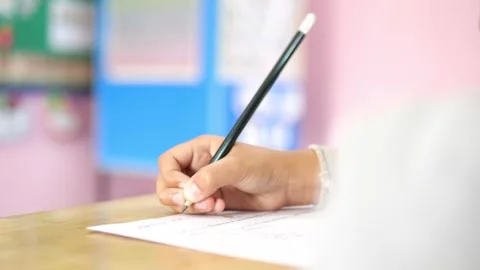 Close-up of student hand writing on paper with pencil, Learning and Academic 스톡 동영상 329355067