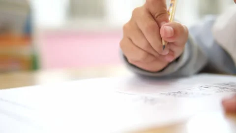Close-up of student hand writing on paper with pencil, Learning and Academic 스톡 동영상 329355071