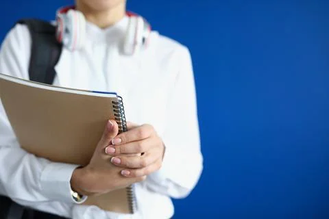 Close-up of student hold stack of books Stock Photos