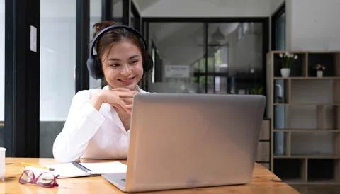 Close up of Student learning online class by using laptop computer and writing Stock Photos