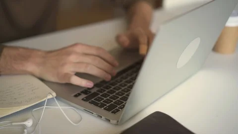 Close up of student male hands doing homework with laptop 스톡 동영상 105596959