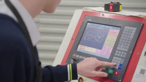 Close Up Of Student Preparing Plasma Cutter CNC Tool In School Industry Stock Footage 211960772