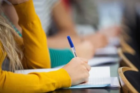 Close up of student taking notes Stock Photos