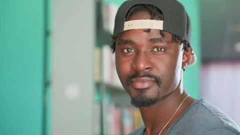 Close Up Student Turning To Camera With Warm Smile In Library Vídeo Stock 318698363