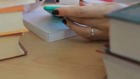 Close up of student using smartphone doing homework. Education, technology, exam Video stock 74987337