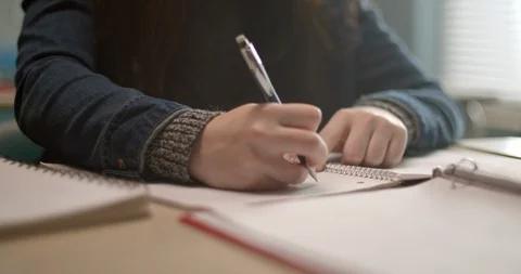 Close up of student writing in notebook 스톡 동영상 118141394