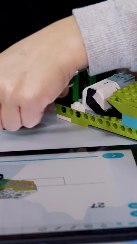 Close-up, students create a device using the designer, according to the drawings Stock Footage 318352405