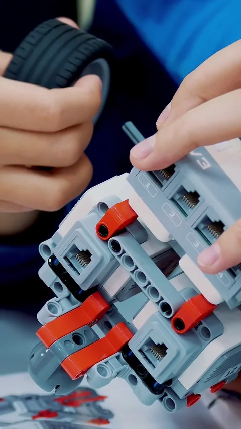 Close-up, students create a device using the designer, non-ferrous parts, blocks Stock-Footage 318463257