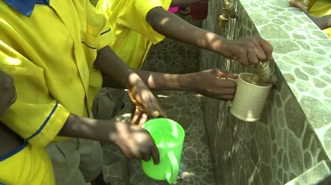 CLOSE UP: STUDENTS FILL WATER CUPS AT FAUCETS Stock Footage 59865160