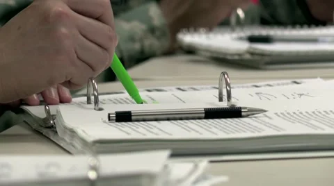 Close Up of Student's Hand in Classroom highlighting and Taking Notes Video stock 63307437