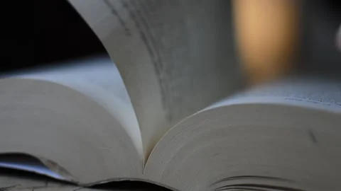 Close-up student's hands opening book and turning page. open book 動画素材 205075275