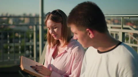 Close-Up of Students Sharing Knowledge Outdoors in Urban Setting Stock Footage 302576541