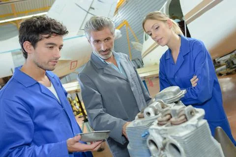 Close up of students viewing aviation components Stock Photos