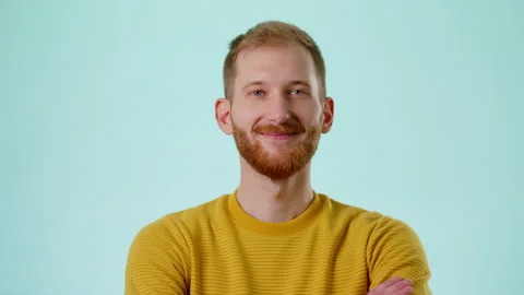 Close Up Studio Portrait Of Confident Smiling Bearded Young Caucasian Man Stock Footage 170190314