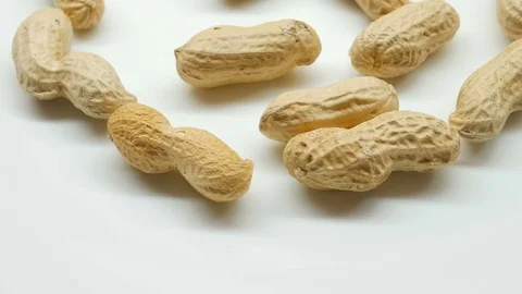 Close-up studio shot footage of peanuts rotates in left side Stock Footage 82633750