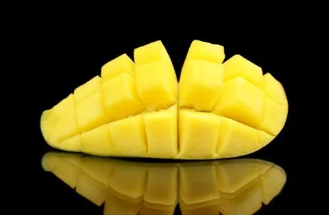 Close-up studio shot mango section piece slice fruit isolated on black backgr Stock Photos