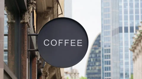 Close-up of a stylish black circular sign with Coffee sign written in white, set Stock Footage 315614925