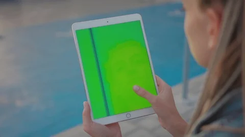 Close-up of stylish girl browsing application on vertical tablet portable Stock Footage 117552728