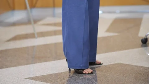 Close-up of stylish legs in office setting Stock Footage 342002412