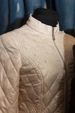 Close-up of a stylish light jacket with beaded details Stock Photos